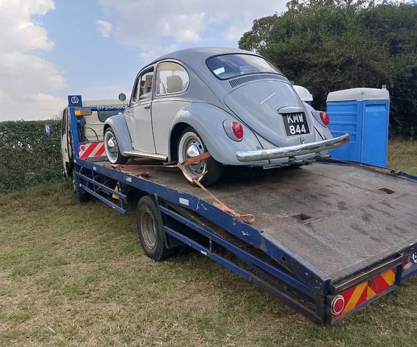 Hard Work Flatbed professional tow truck team at work